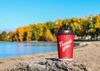 Tim Hortons coffee cup at beach, labelled THANK YOU